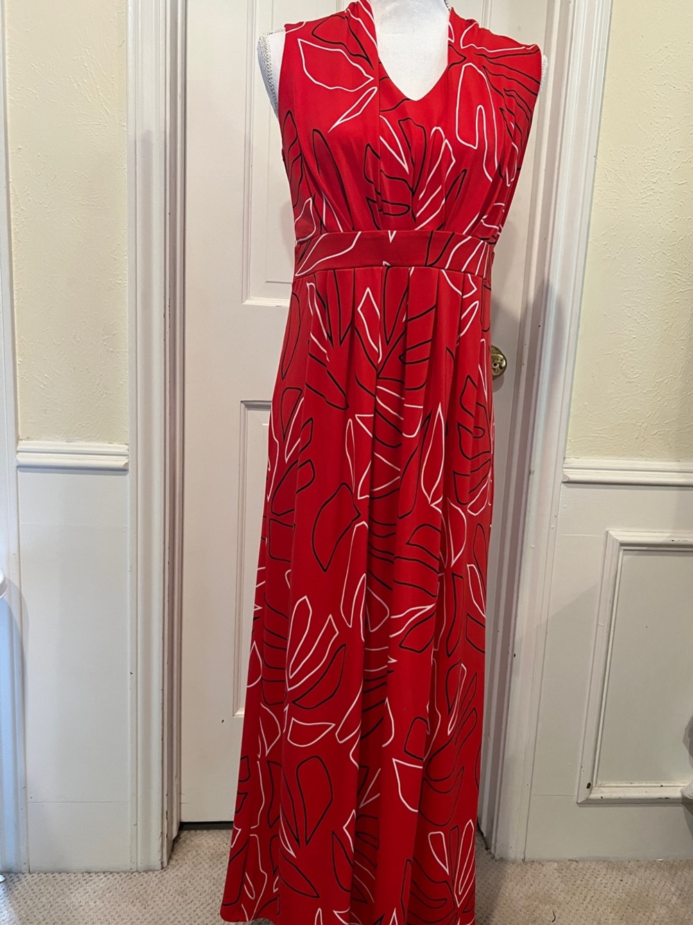 Striking Red V-Neck Maxi Dress with Abstract Leaf Print. Perfect for any season.